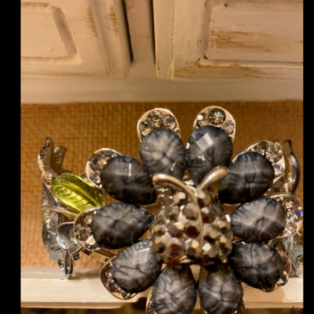 Bracelet with a big Flower with a ladybug on the center and butterfly’s